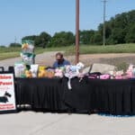 Outdoor pet boutique stall with vendor and products