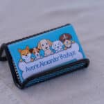 Nameplate with cartoon dogs, 'Averie Alexander Boutique'