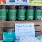 PawTree pet care products displayed on wooden stand