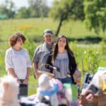 Family shopping together at outdoor market