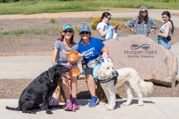 Group with dogs at Morgan Oaks Eternal Preserve